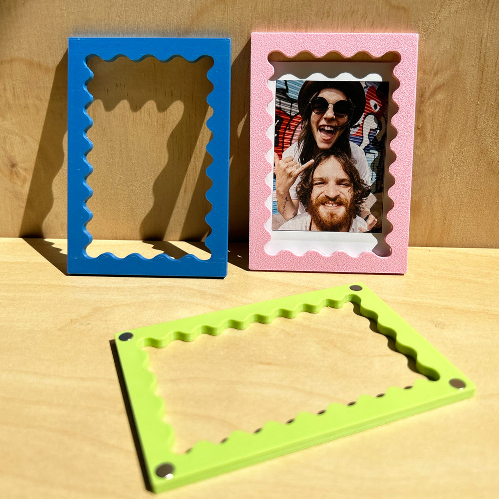 Magnetic polaroid frame with wavy edge on fridge