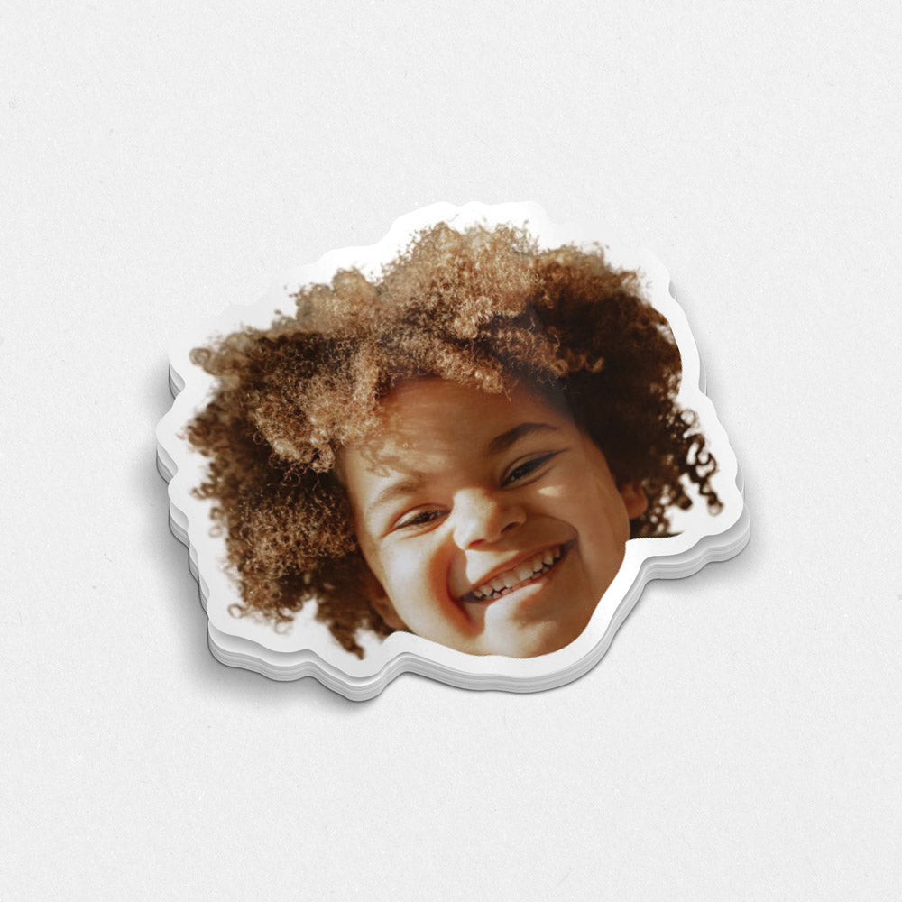 Sticker with a child's face on a white background