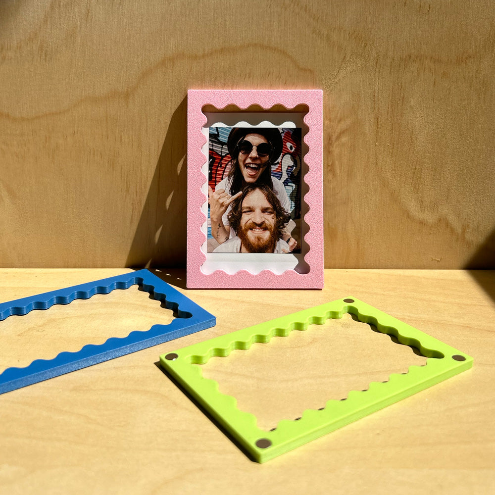 Magnetic polaroid frame with wavy edge on fridge